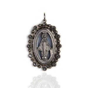 The Milagrosa Medallion in silver features our Lady on a blue background